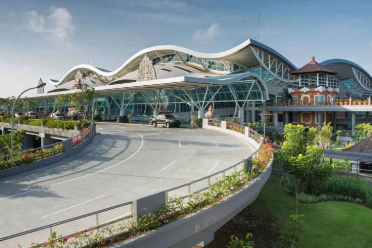 Ngurah Rai International Airport in Bali, Indonesia, with modern architecture and traveler activity.